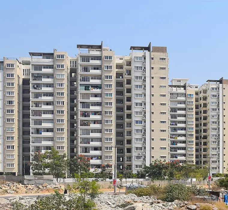 Residential apartment towers in Hyderabad seen from street level