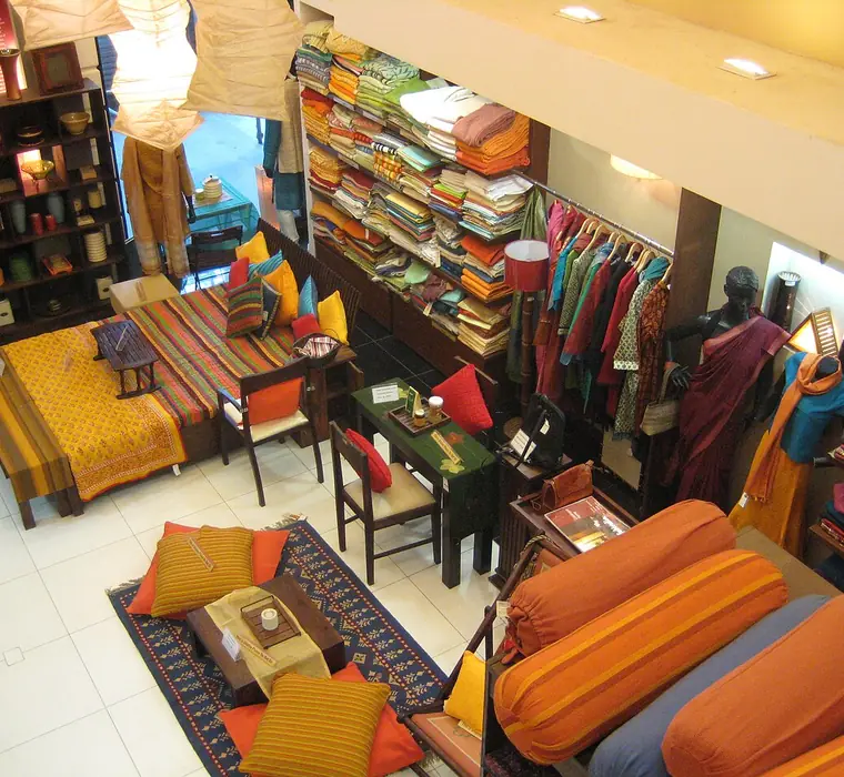 Folded textiles and homeware displayed inside a retail store